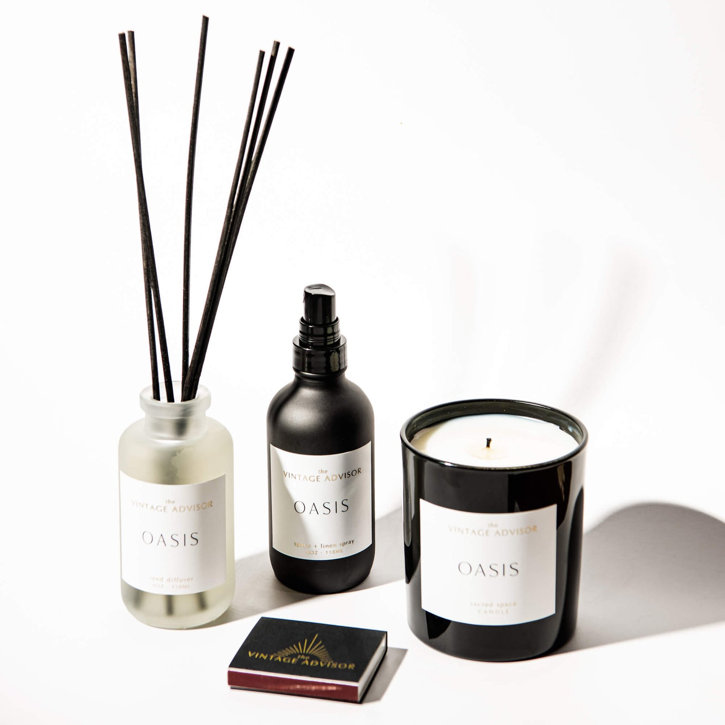 Enchanted Oasis candle, reed diffuser, and room spray with Notes: fig, green leaf, jasmine, moss