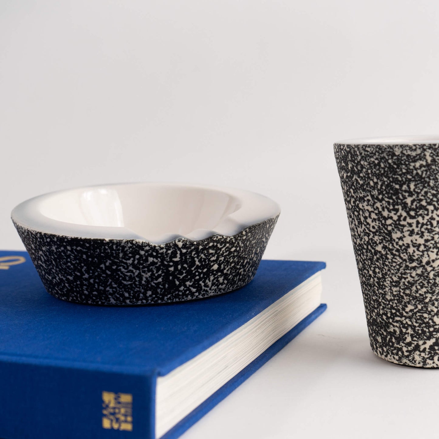 vintage ceramic ashtray with matching pencil cup organizer in black and white speckled texture 