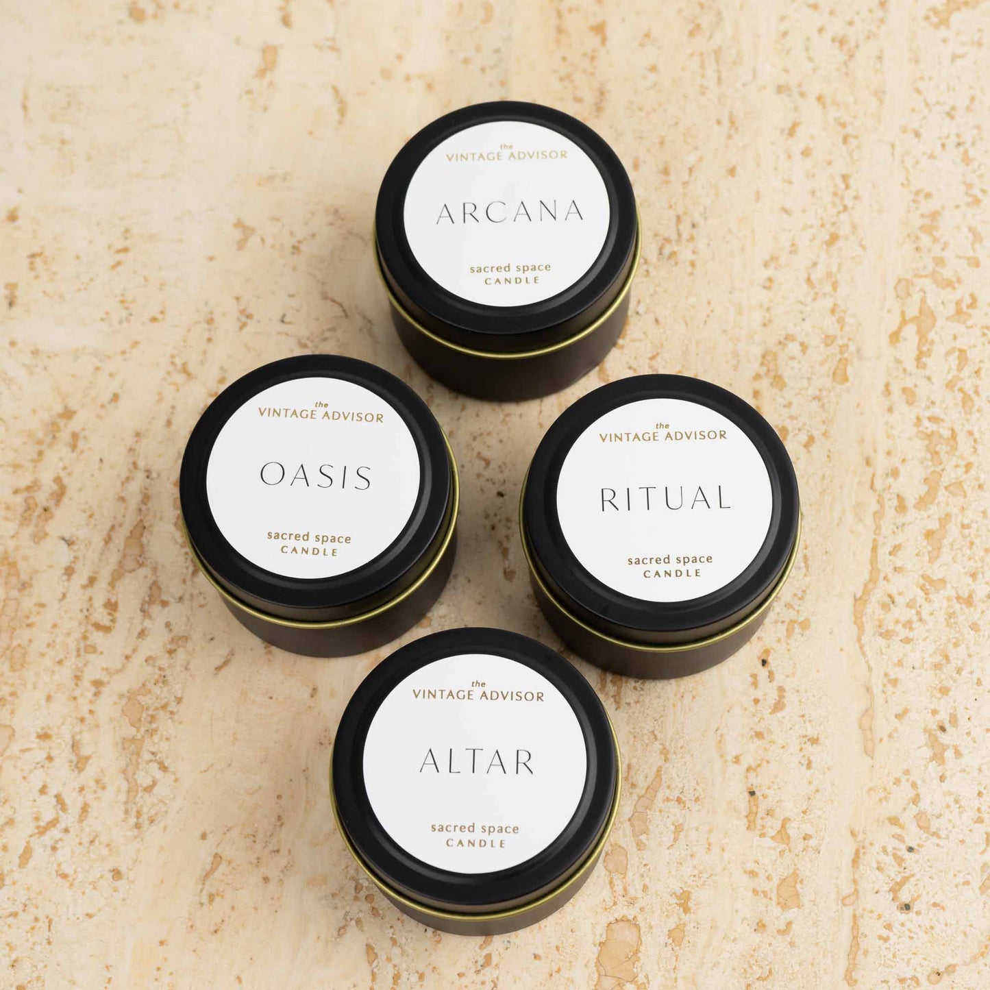 Luxury candle discovery set with four travel-sized signature scented candles in elegant packaging, featuring Oasis, Arcana, Altar and Ritual fragrances
