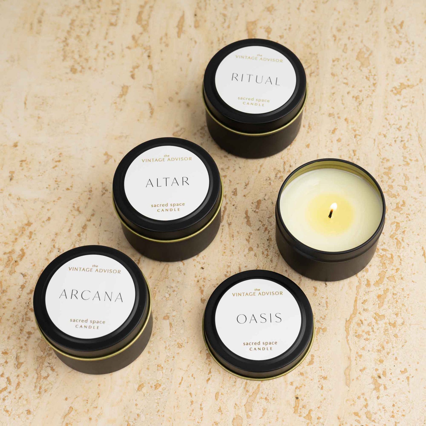 Luxury candle discovery set with four travel-sized signature scented candles in elegant packaging, featuring Oasis, Arcana, Altar and Ritual fragrances