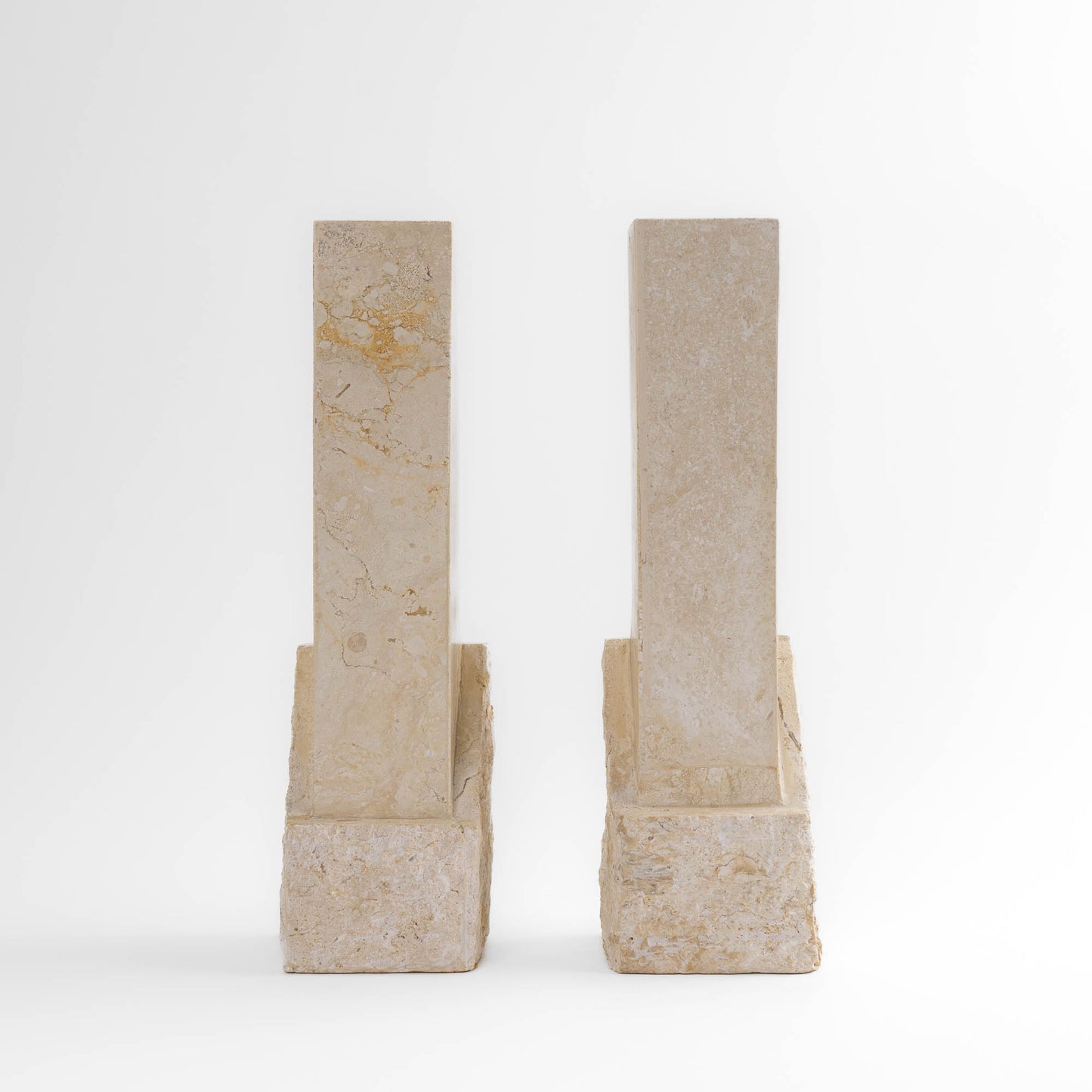 Vintage sculptural travertine candleholder pair with contrasting polished and natural stone textures