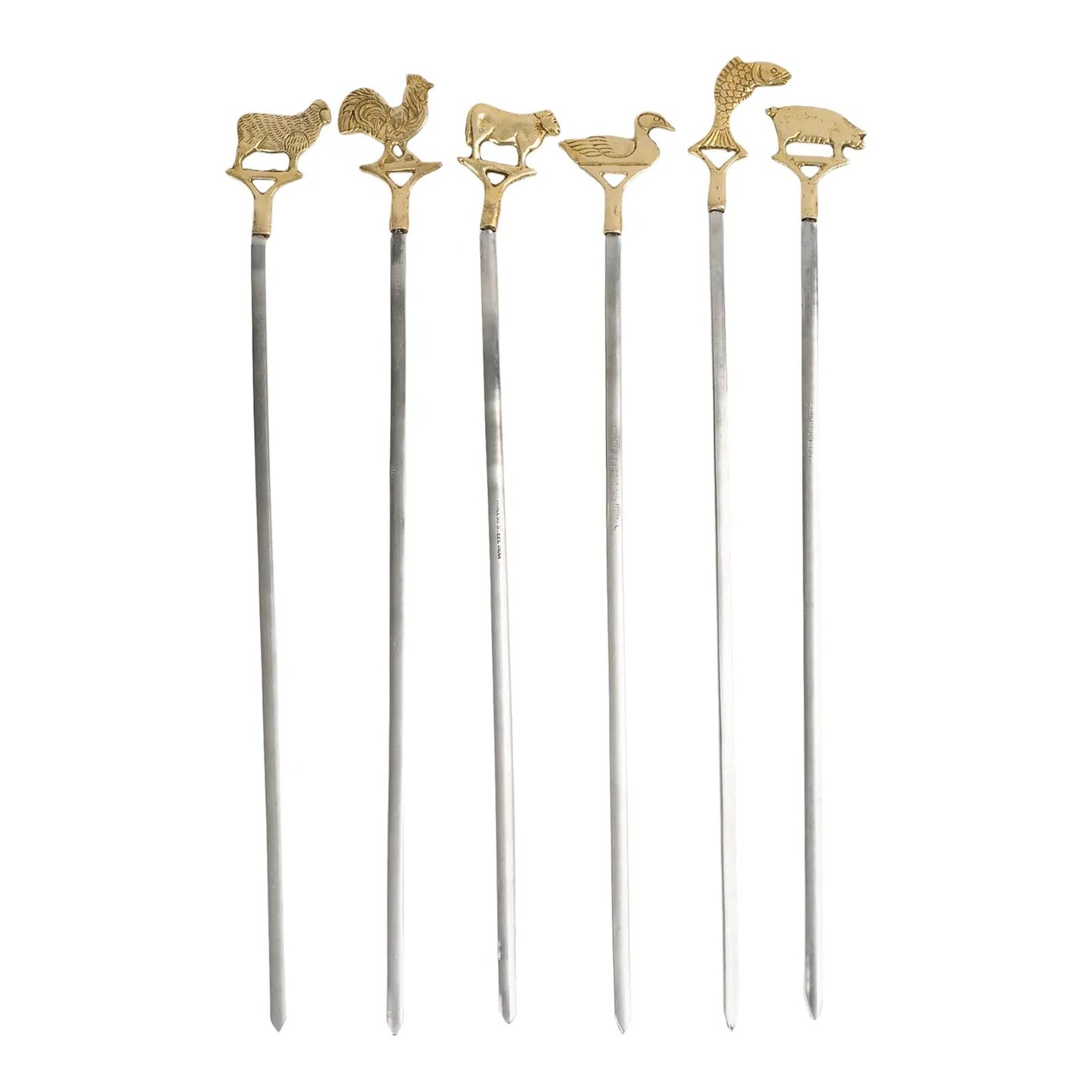 Set of six vintage brass animal barbecue skewers with stainless steel blades, featuring sheep, rooster, cow, duck, fish, and pig handles from the 1960s-70s