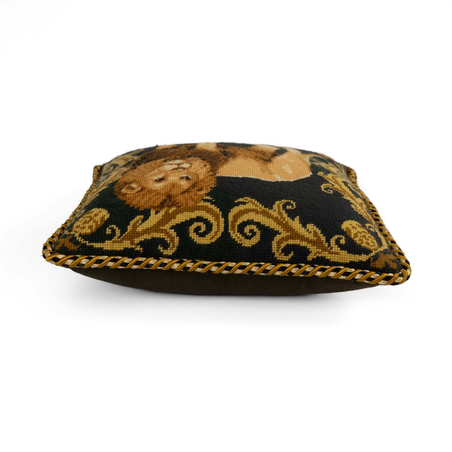 Vintage square needlepoint pillow featuring embroidered lion with decorative scroll border and braided rope piping