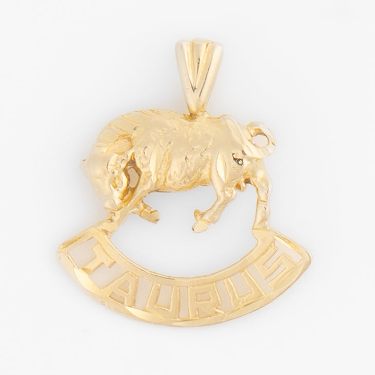 Vintage 14k yellow gold Taurus pendant with 3D bull design and Taurus text
