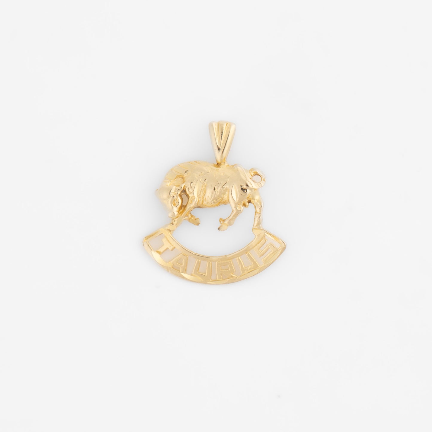 Vintage 14k yellow gold Taurus zodiac charm pendant with 3D bull design and Taurus text