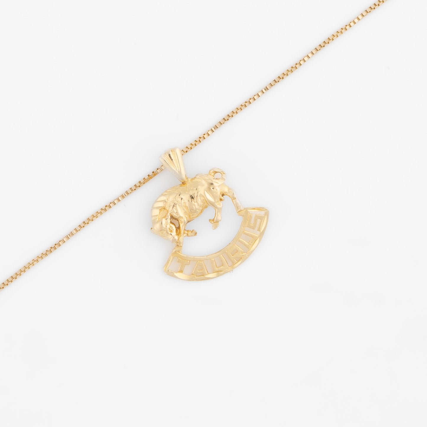 Vintage 14k yellow gold Taurus charm with 3D bull design and Taurus text