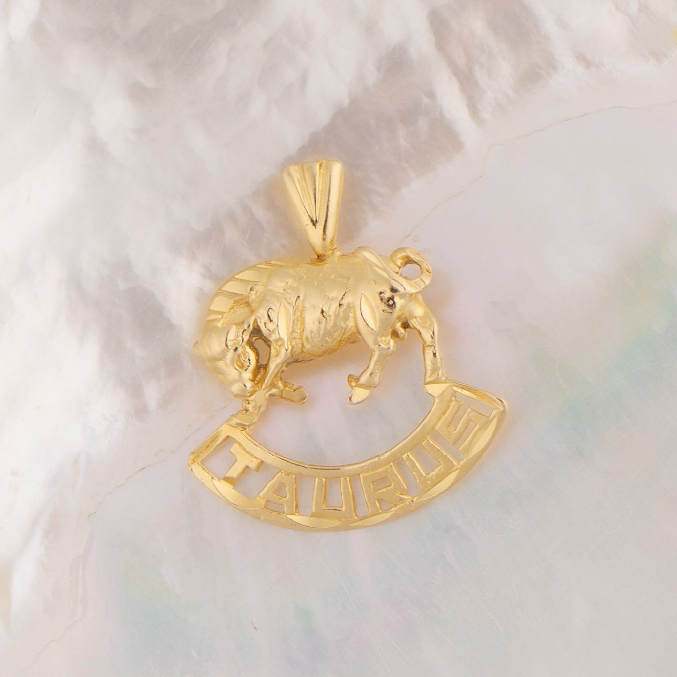 Vintage 14k yellow gold Taurus charm with 3D bull design and Taurus text