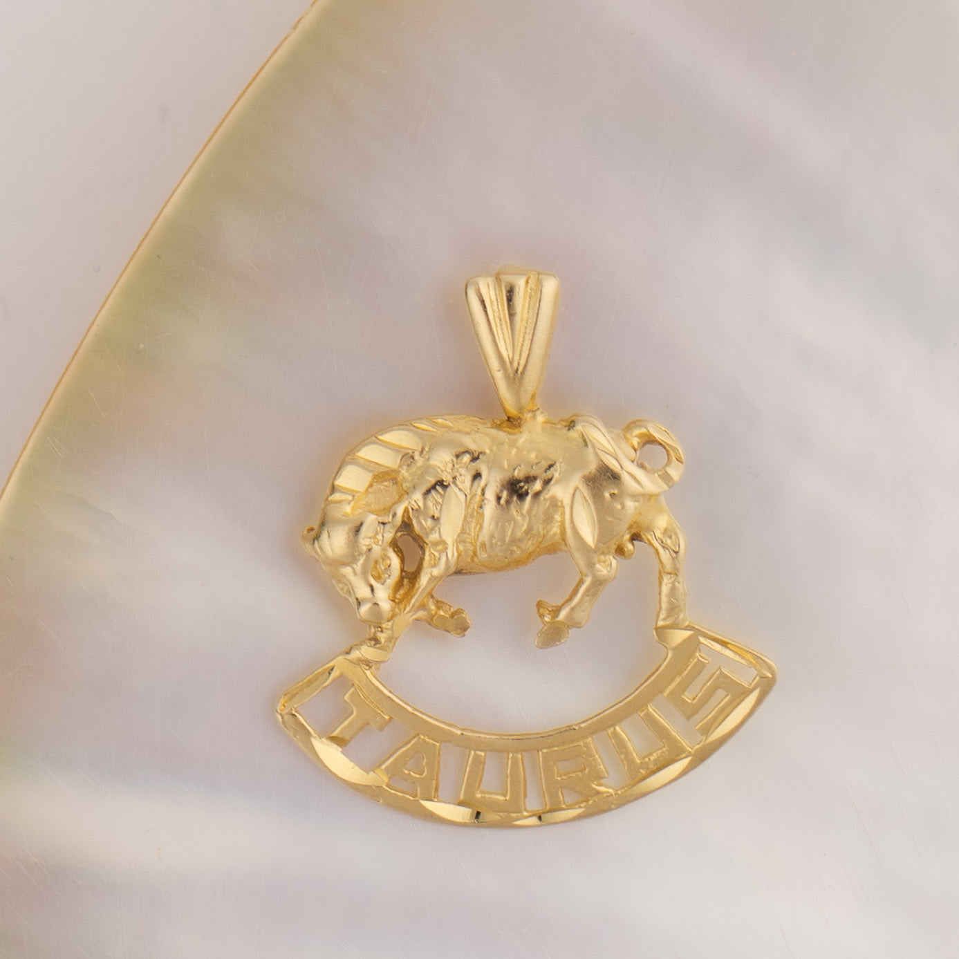 Vintage 14k yellow gold Taurus pendant with 3D bull design and Taurus text