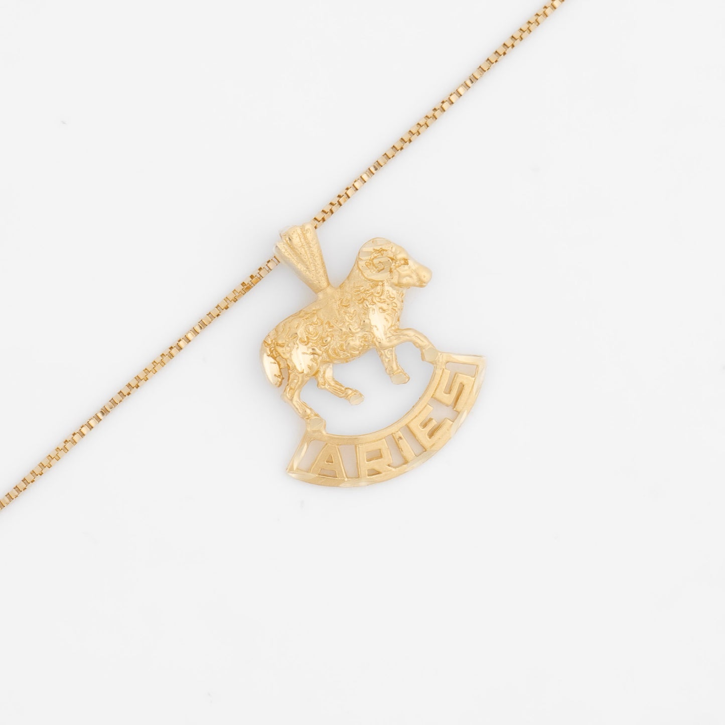 Vintage 14k yellow gold Aries charm with 3D ram design and Aries text