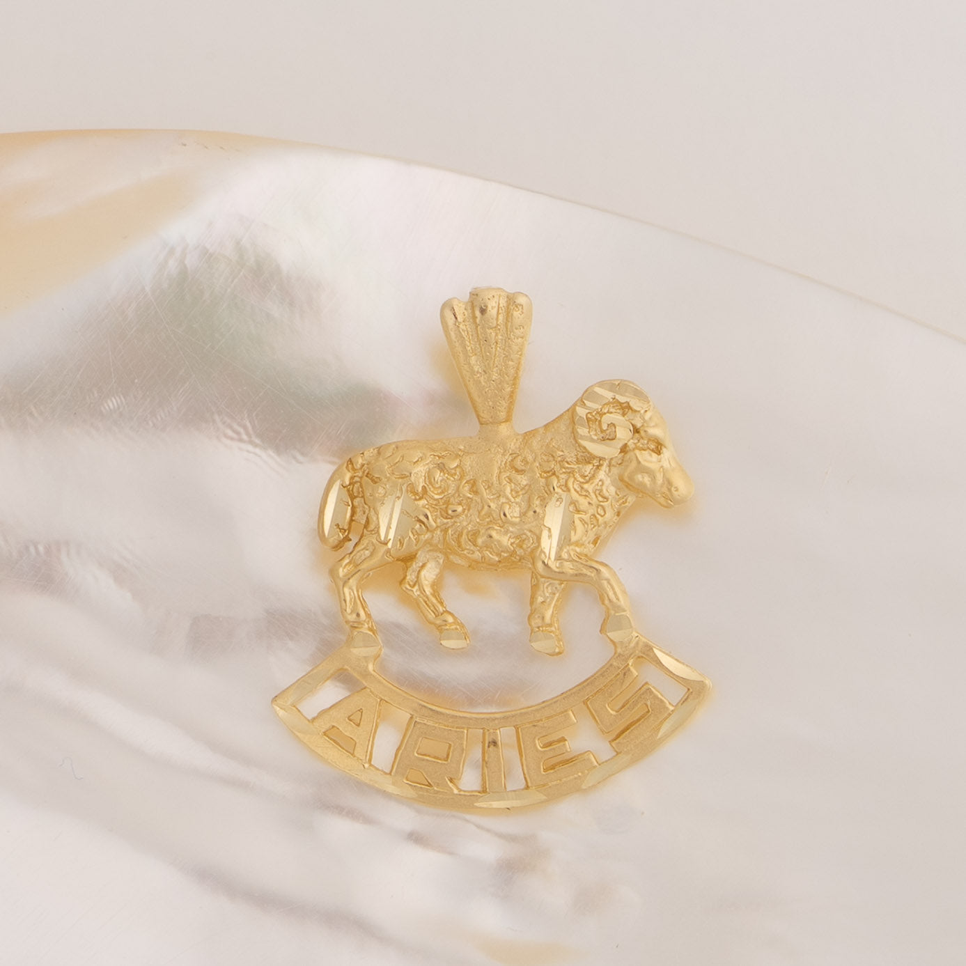 Vintage 14k yellow gold Aries charm with 3D ram design and Aries text