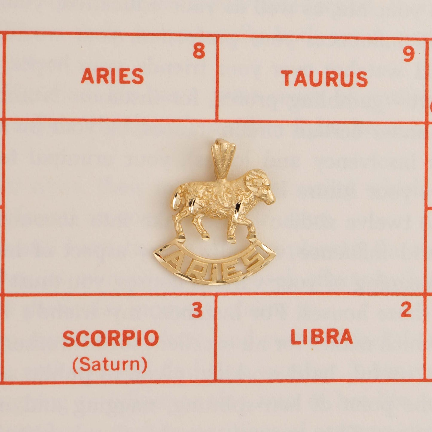 Vintage 14k yellow gold Aries pendant with 3D ram design and Aries text