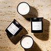 hand-poured non toxic candles on a travertine table - the sacred space collection by the vintage advisor 