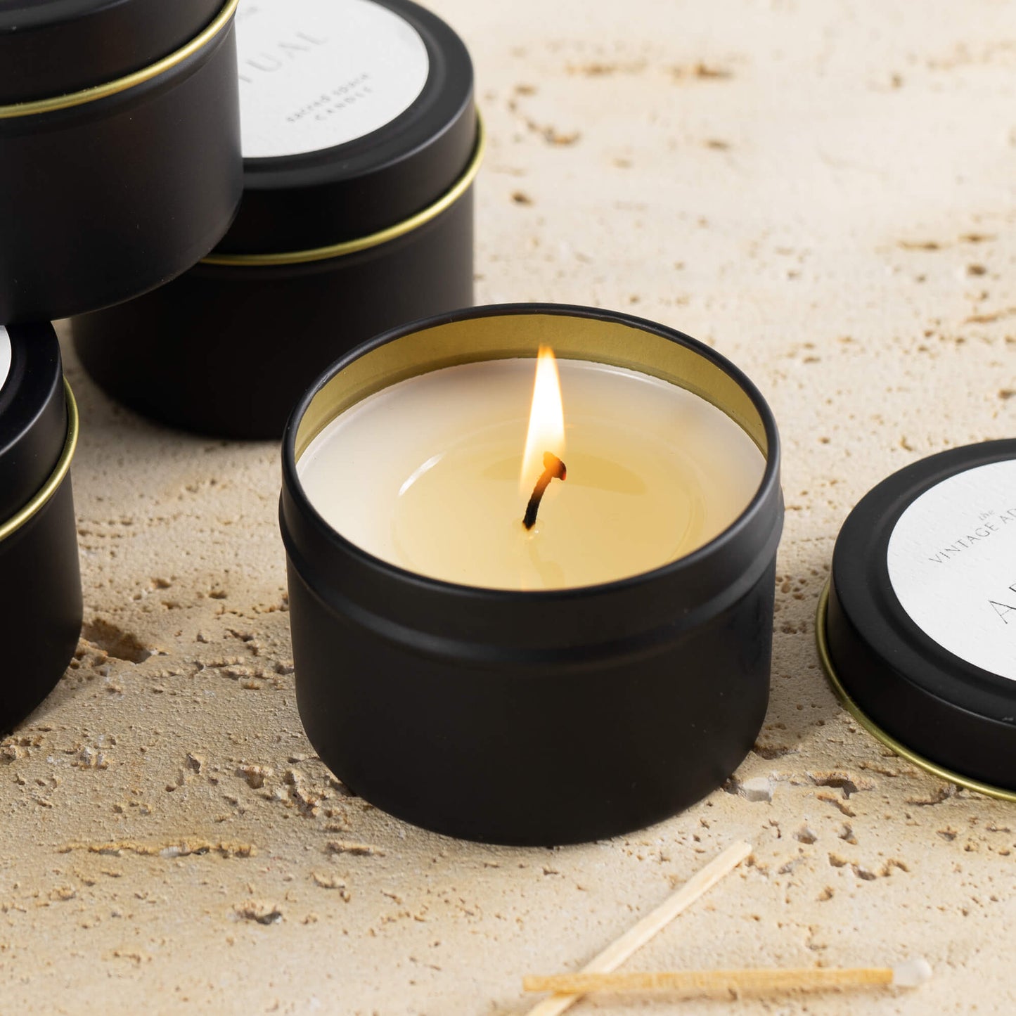 Lit candle -  4 Travel-sized Candles in Luxury Set 