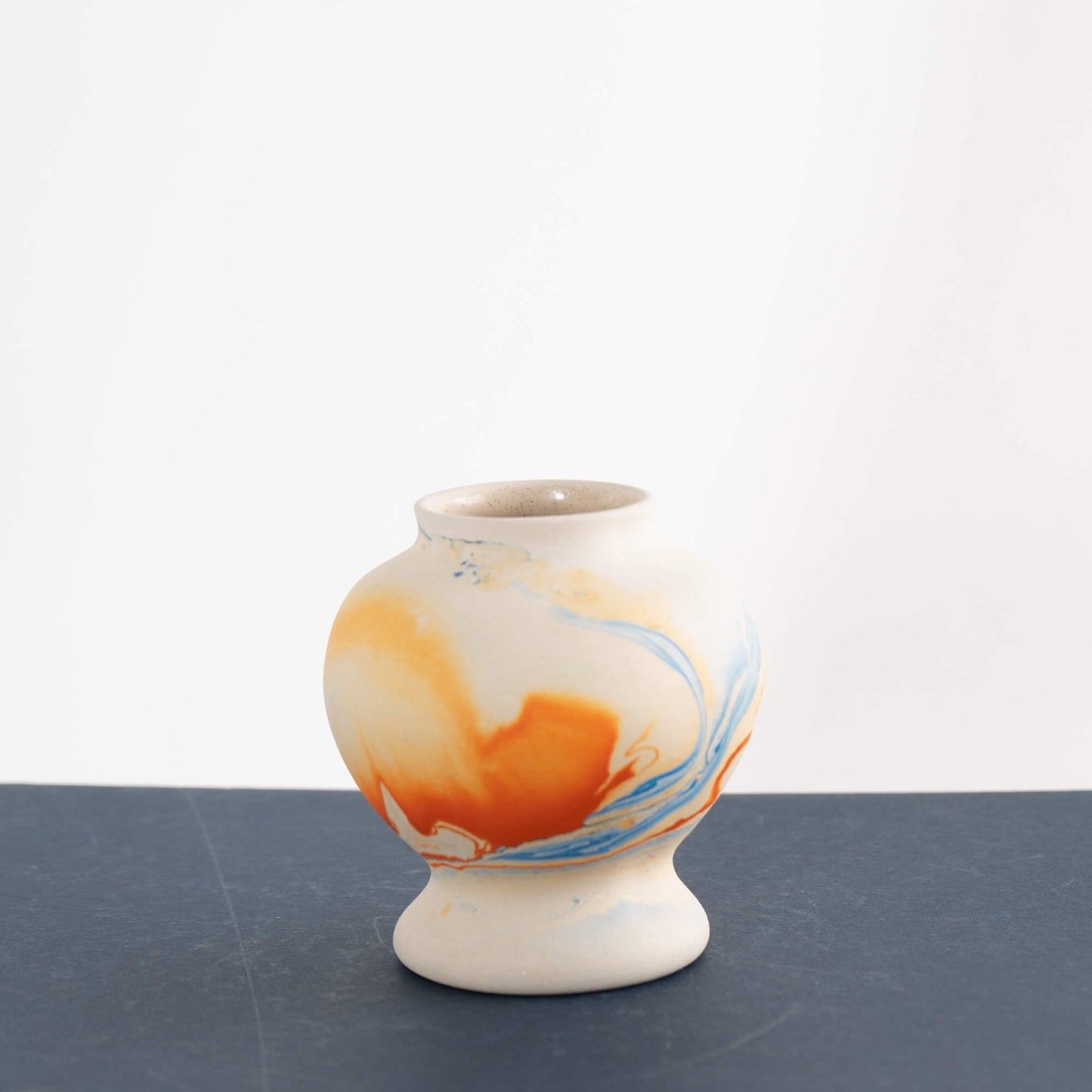 Load image into Gallery viewer, Mini Nemadji Pottery Vase with orange and blue marbling 
