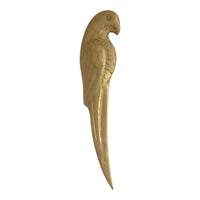 Vintage brass letter opener shaped like a parrot with detailed feather texture and curved beak, circa 1960s-1970s