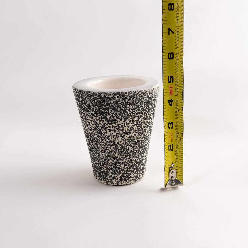 
                  
                    vintage ceramic ashtray with matching pencil cup organizer in black and white speckled texture 
                  
                