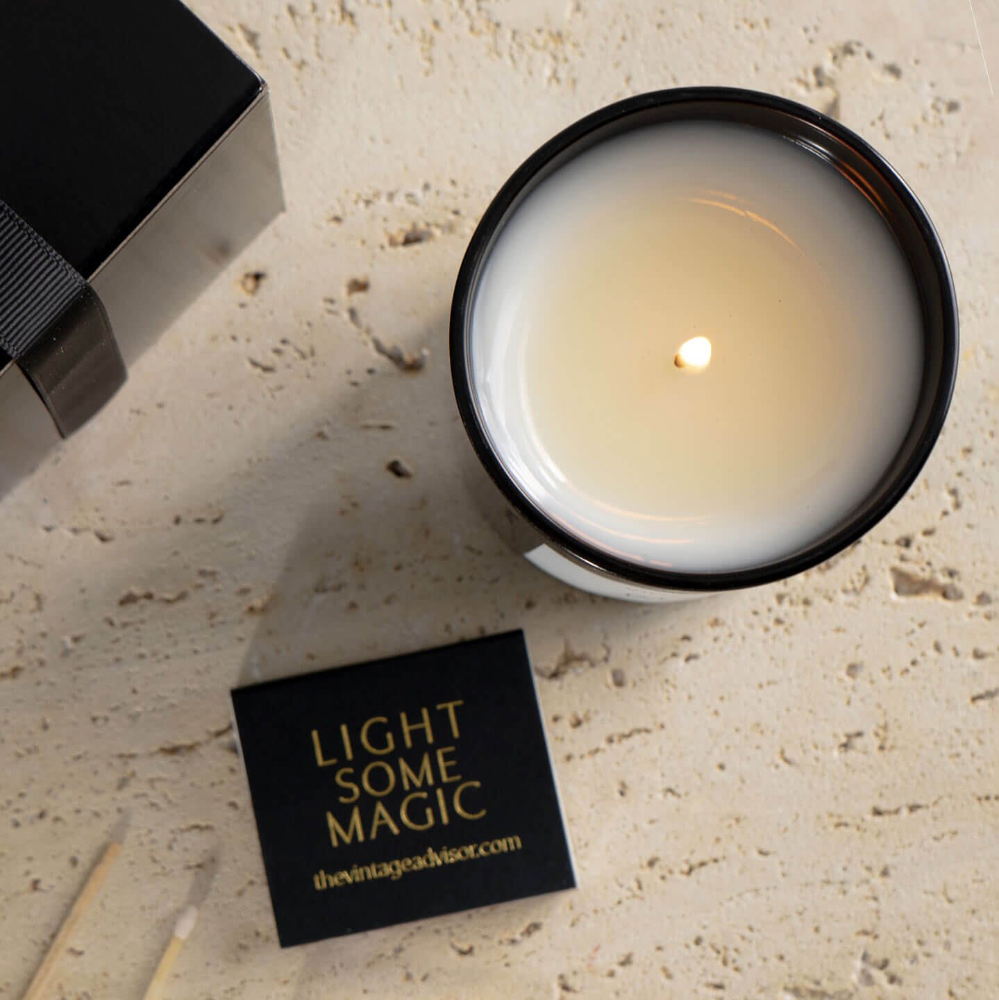 
								lit luxury candle with matches 
								