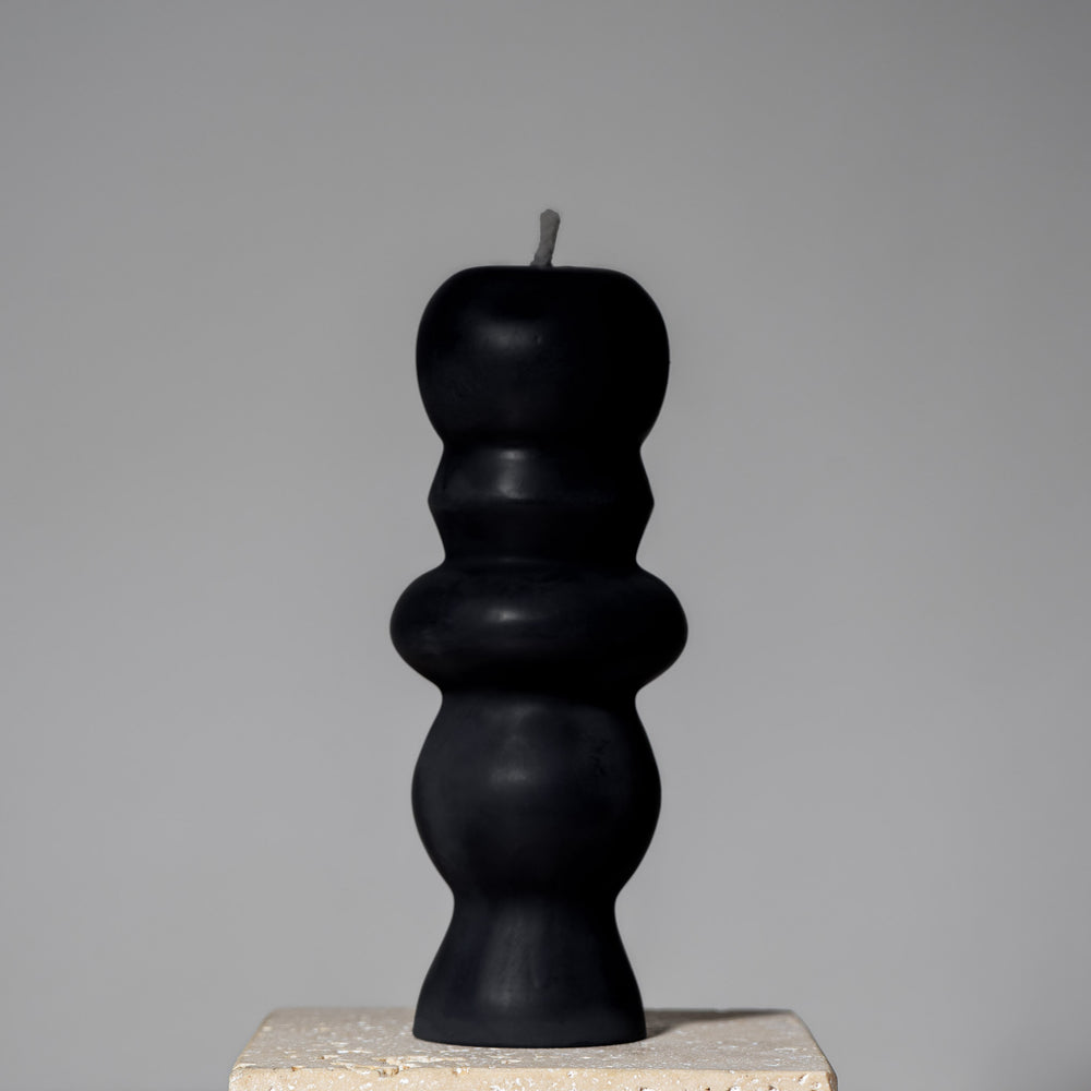 
                  
                    postmodern sculptural beeswax pillar candle midnight black
                  
                