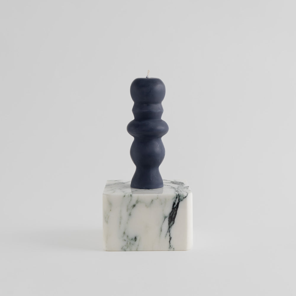 
                      
                        handcrafted all natural beeswax and soy pillar candle inspired by postmodern temple columns and architecture in midnight black
                      
                    