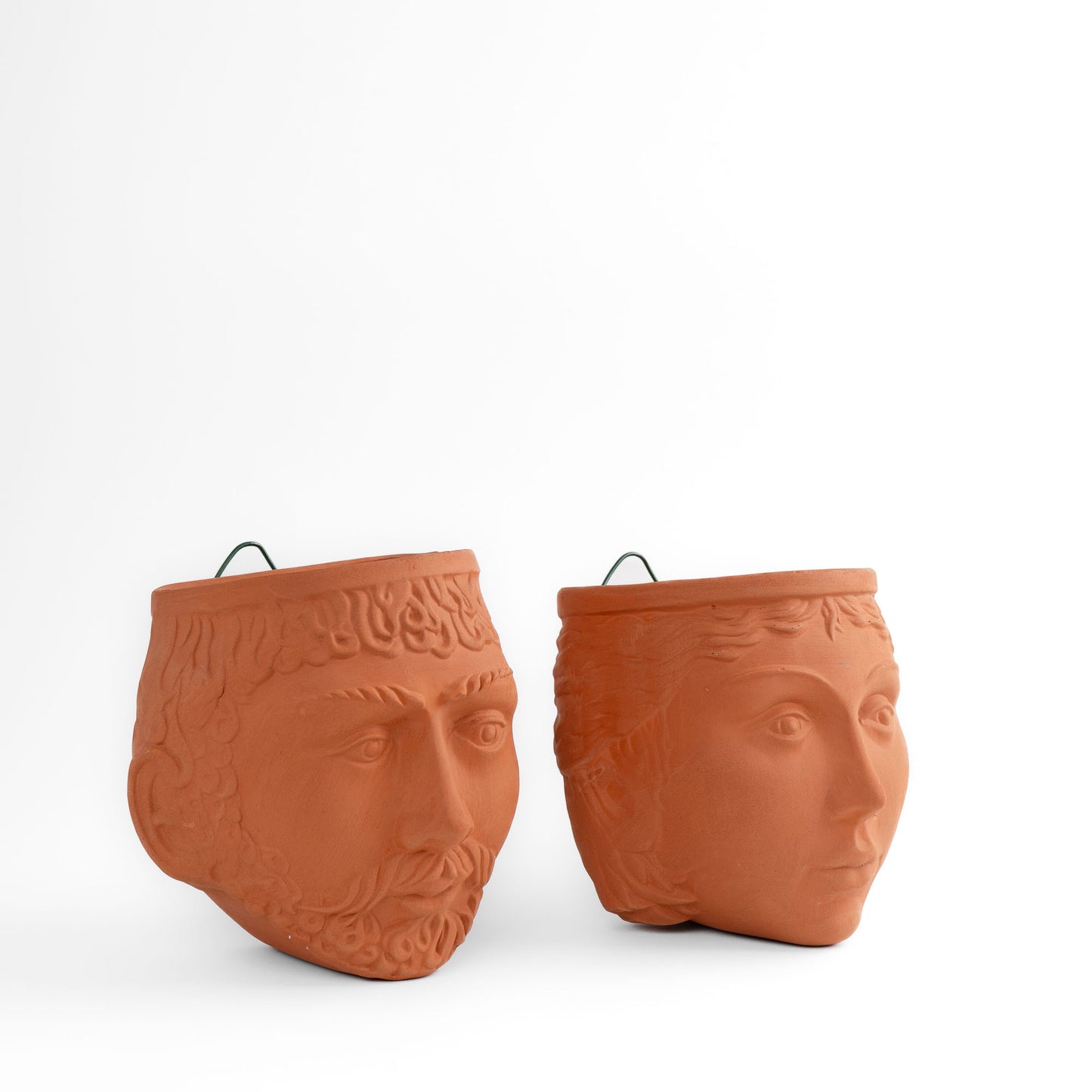 Pair of vintage Rookes Pottery terracotta wall planters featuring mythological god and goddess faces, made in England