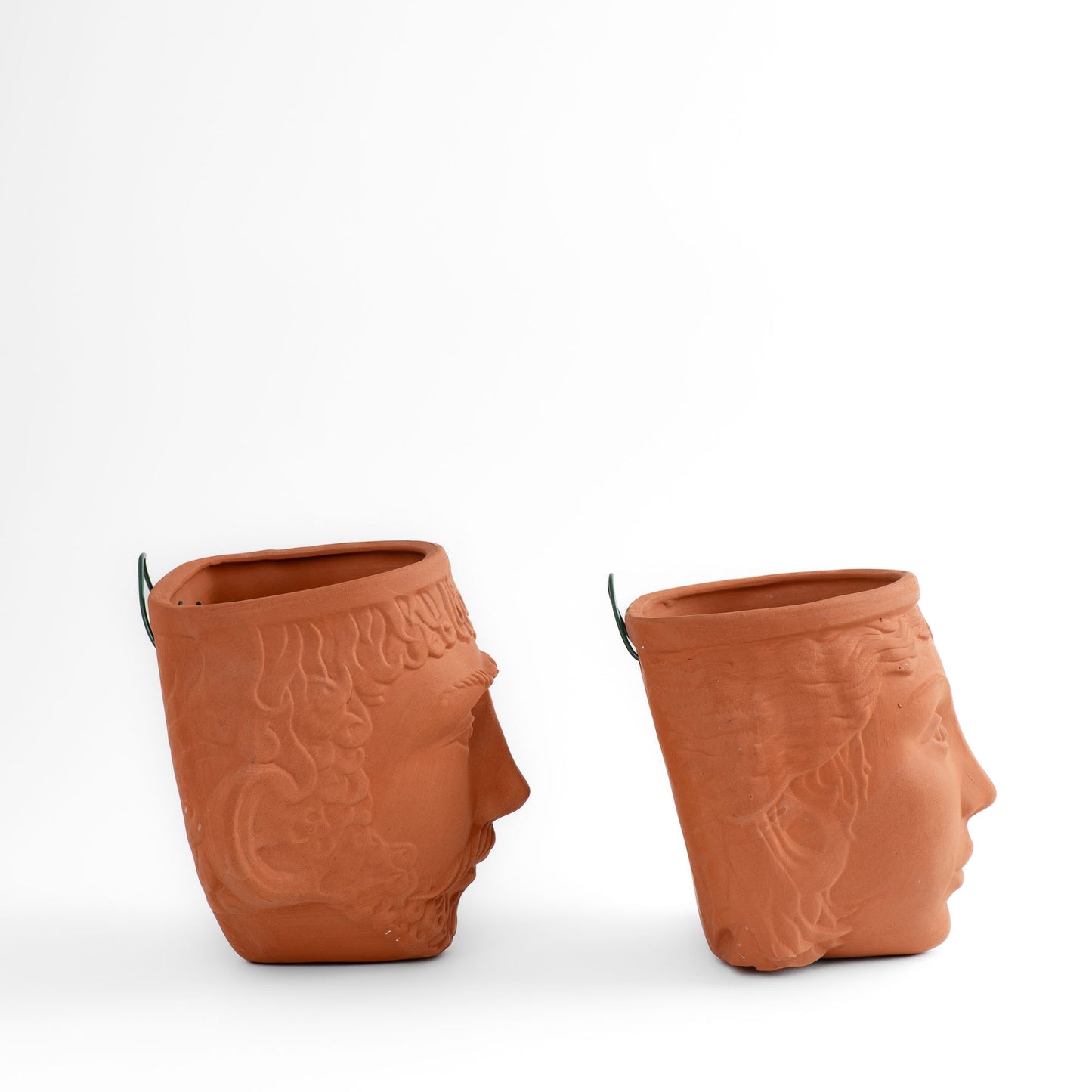 Pair of vintage Rookes Pottery terracotta wall planters featuring mythological god and goddess faces, made in England