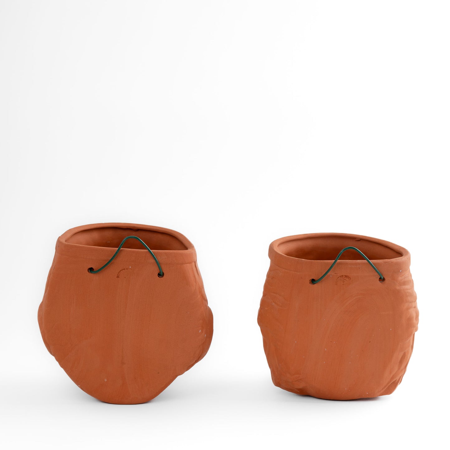 Pair of vintage Rookes Pottery terracotta wall planters featuring mythological god and goddess faces, made in England