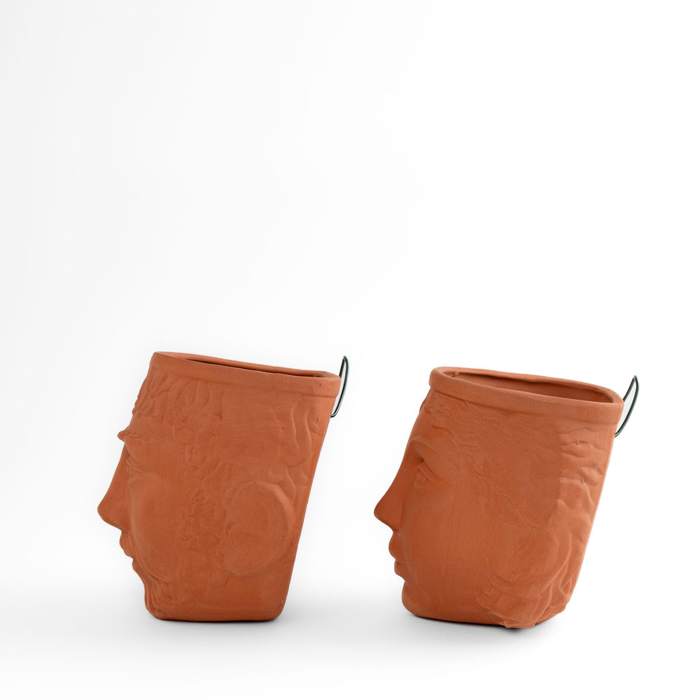
                  
                    Pair of vintage Rookes Pottery terracotta wall planters featuring mythological god and goddess faces, made in England
                  
                