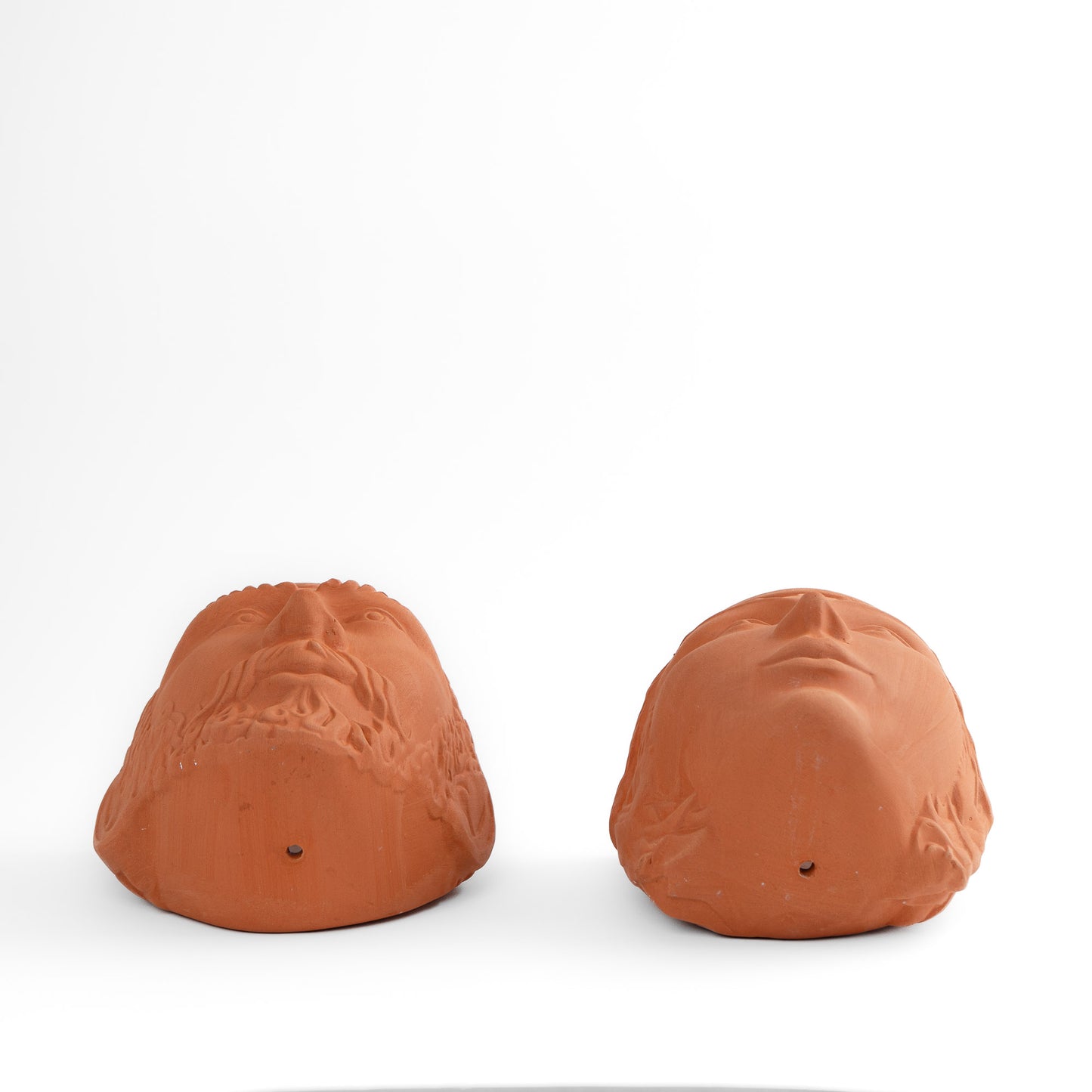 Pair of vintage Rookes Pottery terracotta wall planters featuring mythological god and goddess faces, made in England