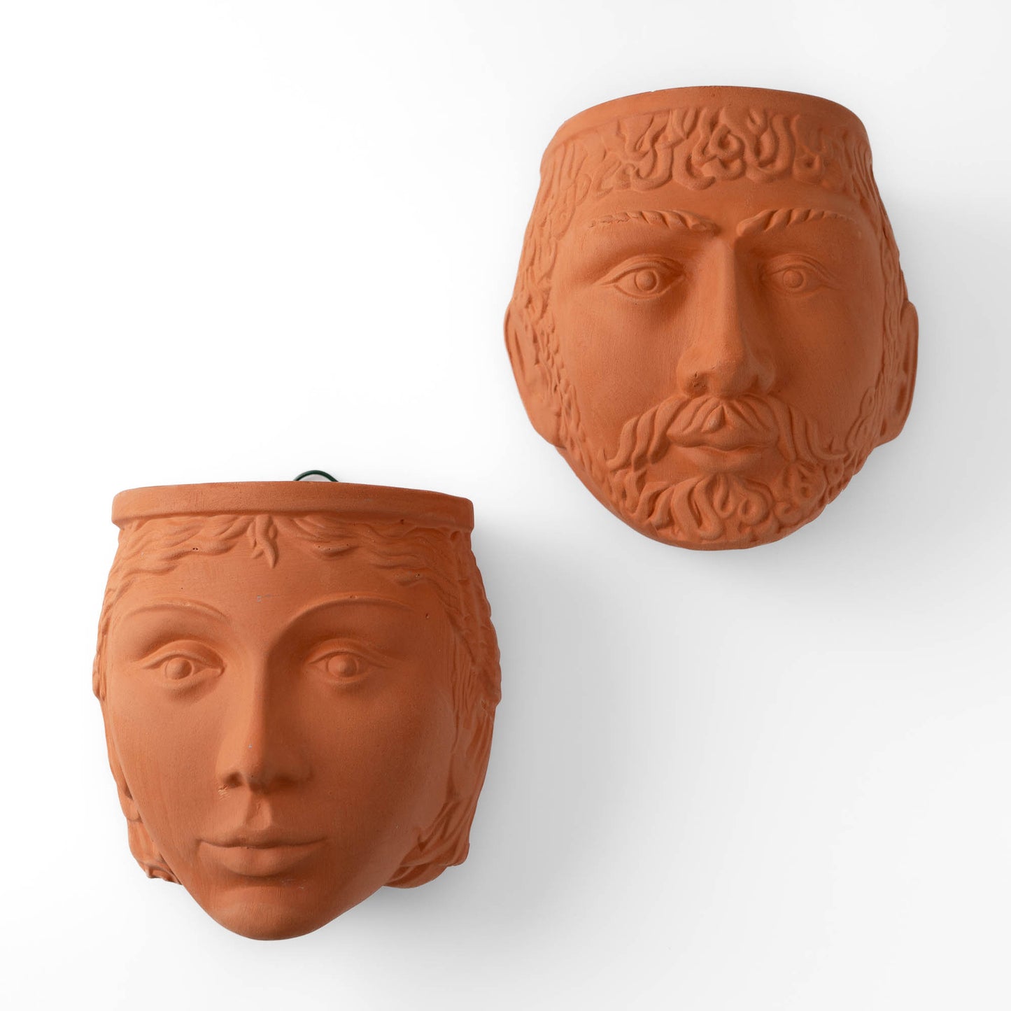 Pair of vintage Rookes Pottery terracotta wall planters featuring mythological god and goddess faces, made in England