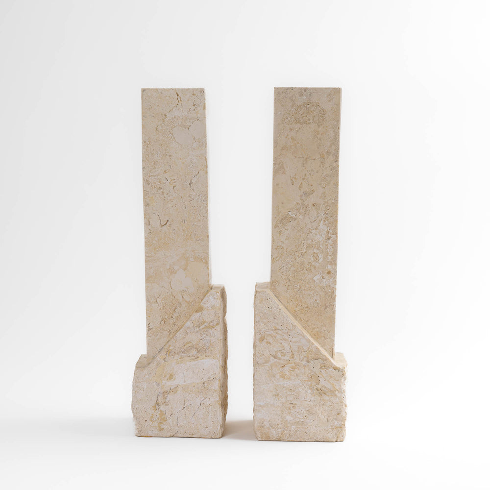 
                  
                    Vintage sculptural travertine candleholder pair with contrasting polished and natural stone textures
                  
                