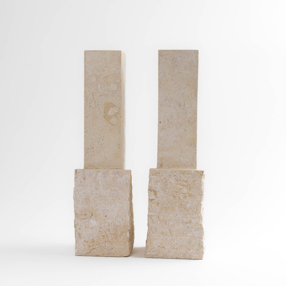 
                  
                    Vintage sculptural travertine candleholder pair with contrasting polished and natural stone textures
                  
                