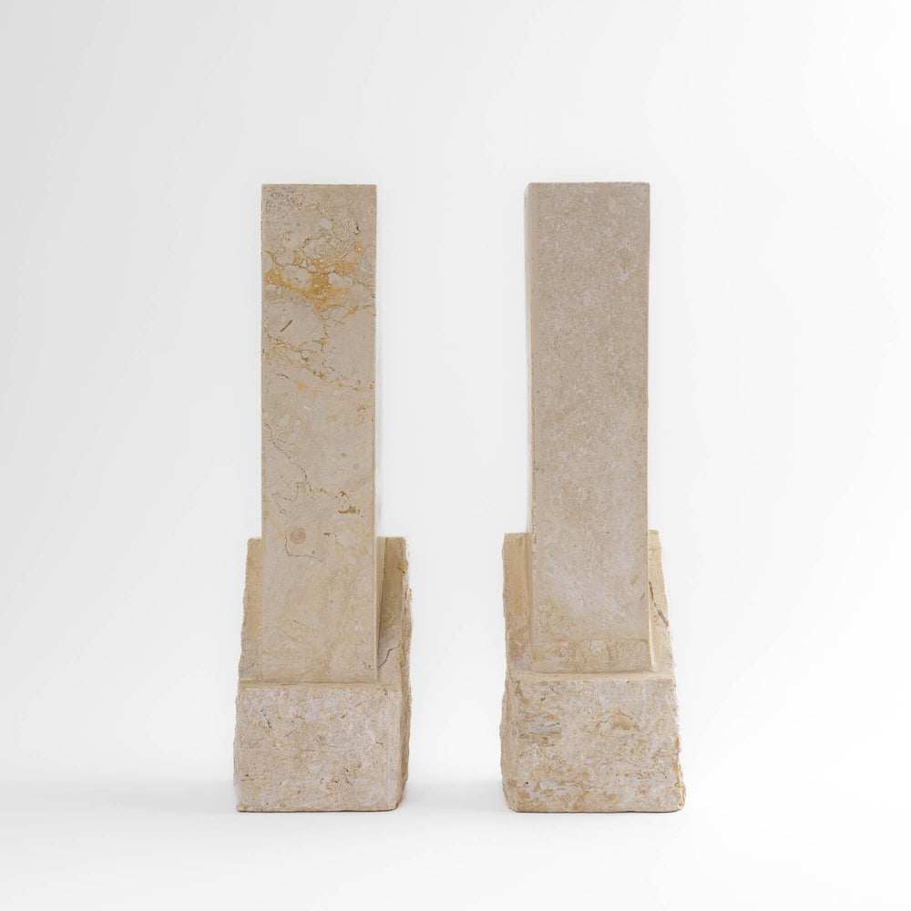 
                  
                    Vintage sculptural travertine candleholder pair with contrasting polished and natural stone textures
                  
                