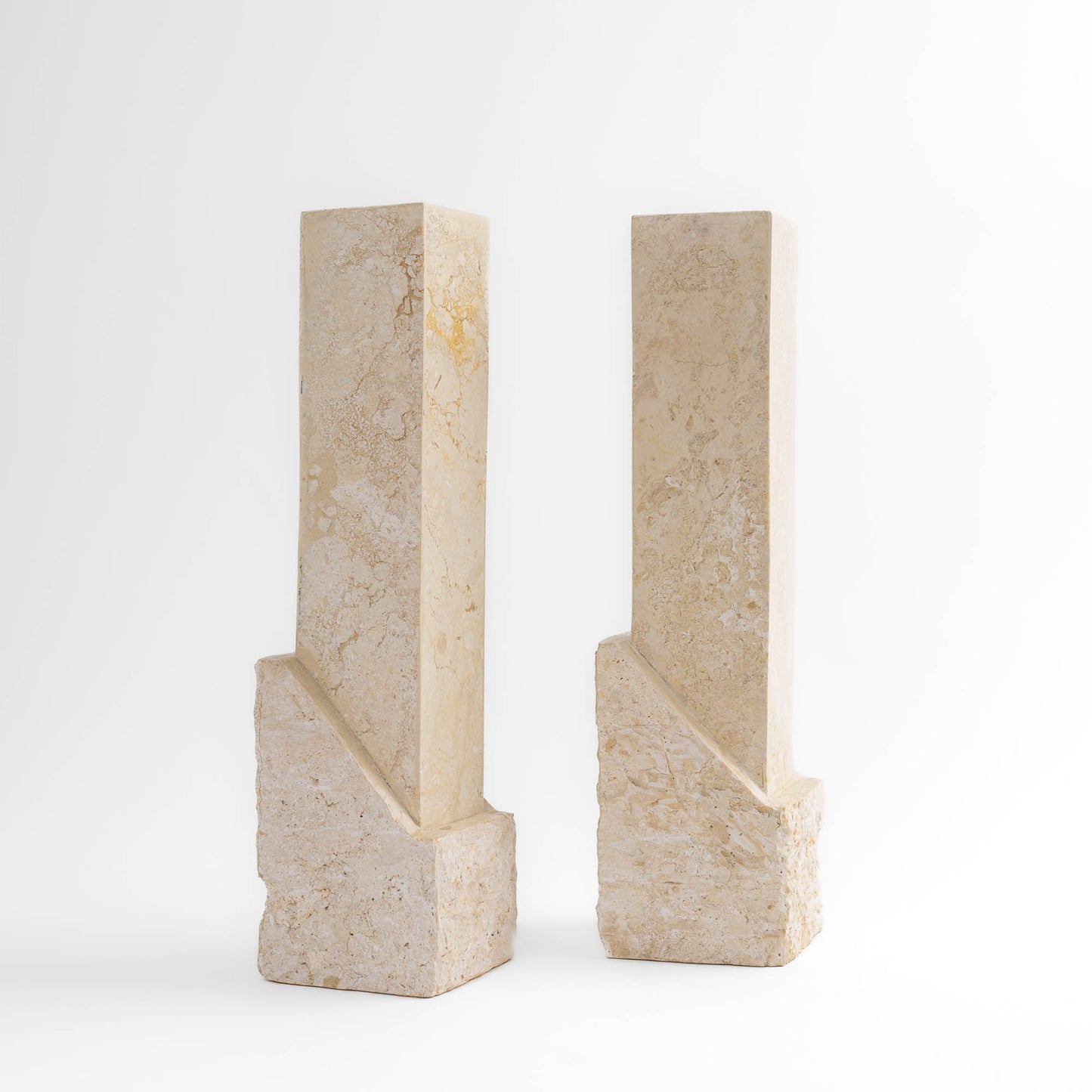 Vintage sculptural travertine candleholder pair with contrasting polished and natural stone textures