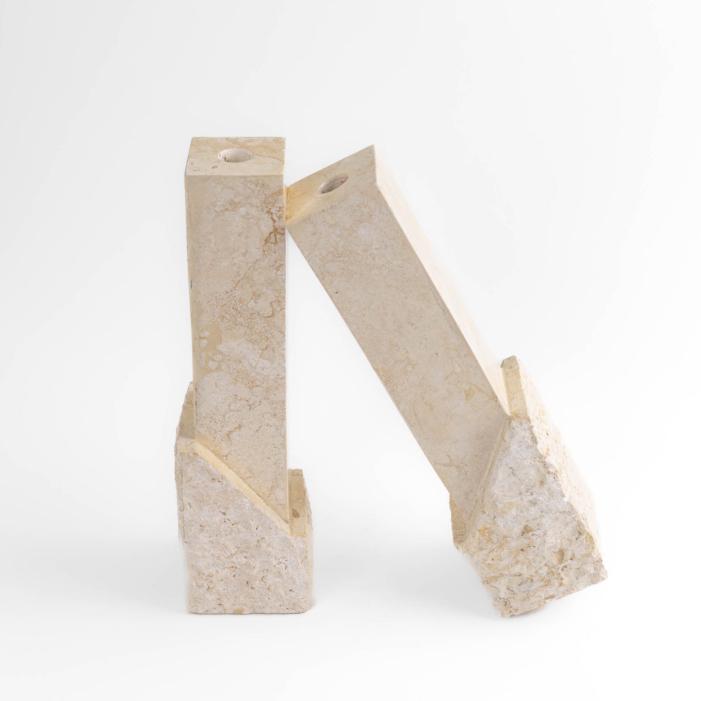 Vintage sculptural travertine candleholder pair with contrasting polished and natural stone textures