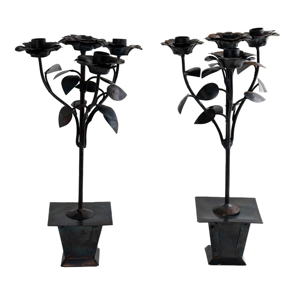 Vintage hand-crafted iron candelabra set featuring three blooming roses as taper candle holders atop a square planter base with detailed leafwork