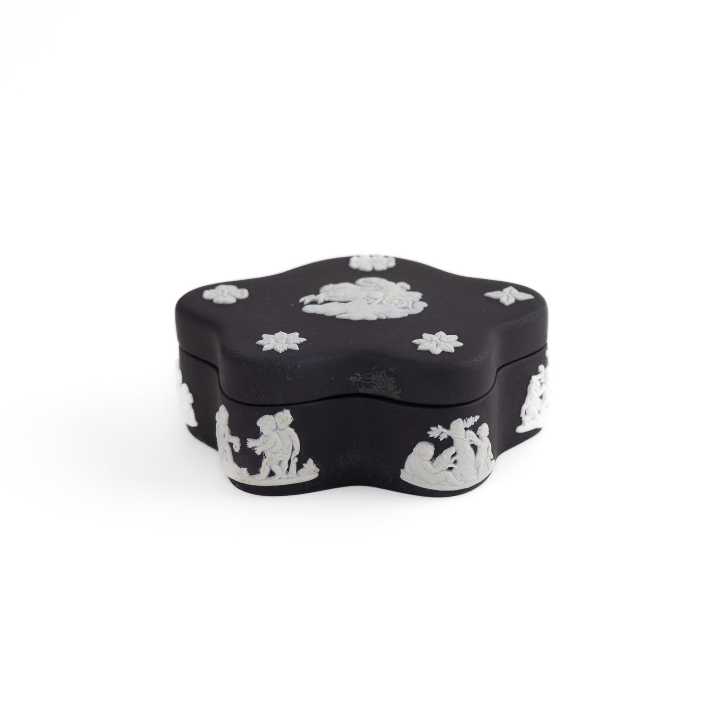 Vintage star-shaped Wedgwood black jasperware trinket box with white relief of Aurora Goddess of Dawn and cherub motifs, 1970s collectible.