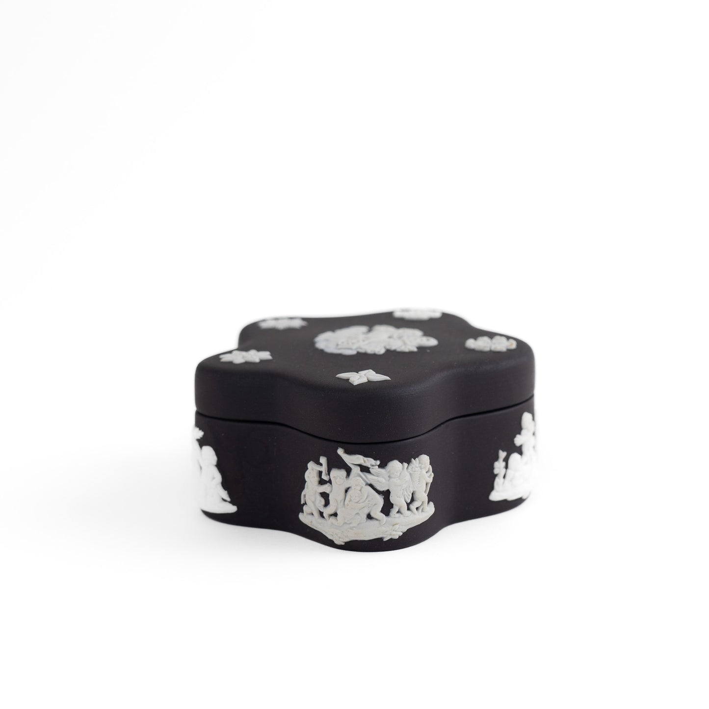 Vintage star-shaped Wedgwood black jasperware trinket box with white relief of Aurora Goddess of Dawn and cherub motifs, 1970s collectible.