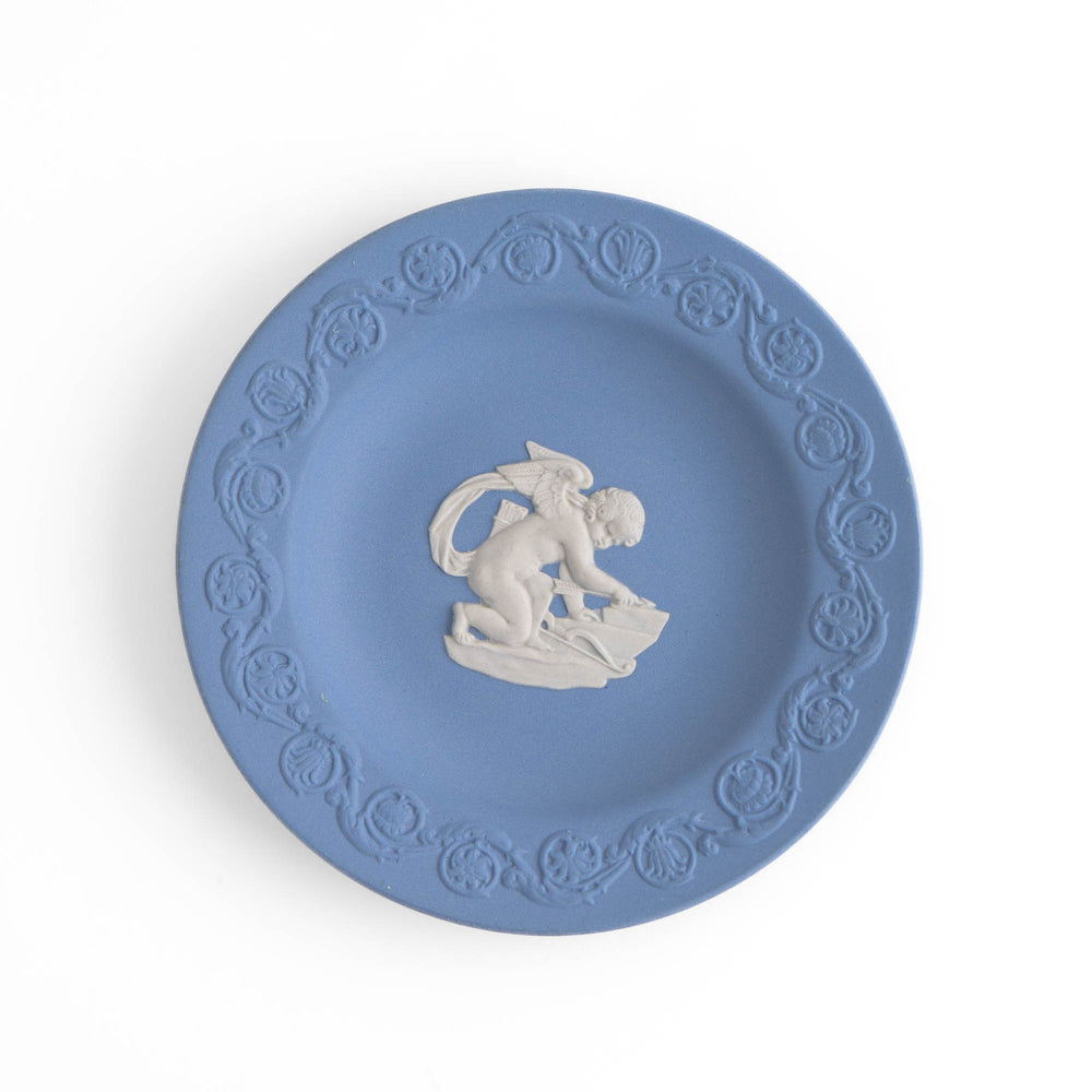 
                  
                    Vintage blue Wedgwood jasperware plate featuring white relief of Cupid, 1970s collectible decorative plate
                  
                