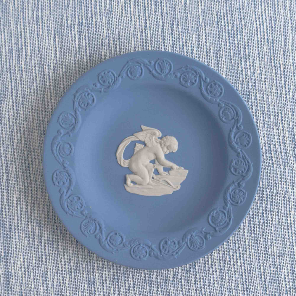 
                  
                    Vintage blue Wedgwood jasperware plate featuring white relief of Cupid, 1970s collectible decorative plate
                  
                