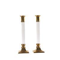 Vintage pair of transparent Lucite candleholders with brass accents for taper candles, styled in Hollywood Regency interior