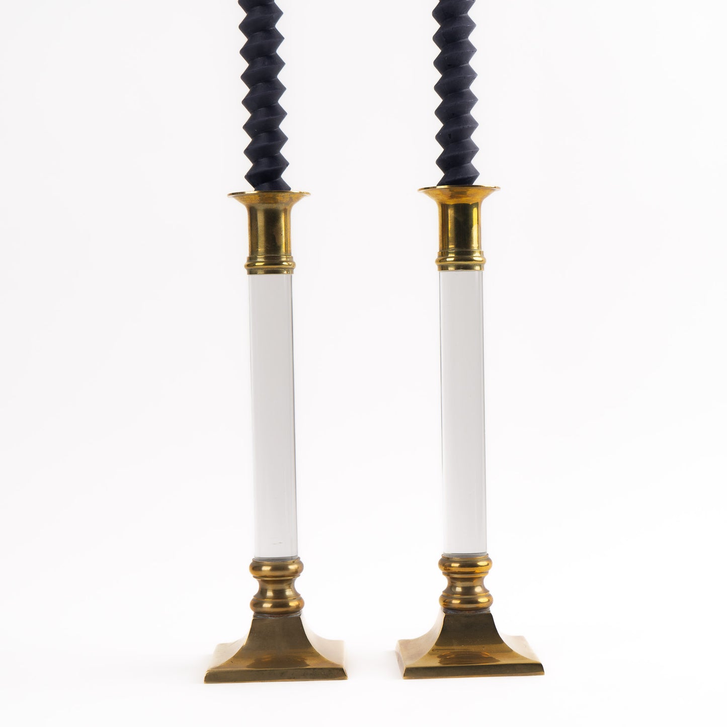 Vintage pair of transparent Lucite candleholders with brass accents for taper candles, styled in Hollywood Regency interior