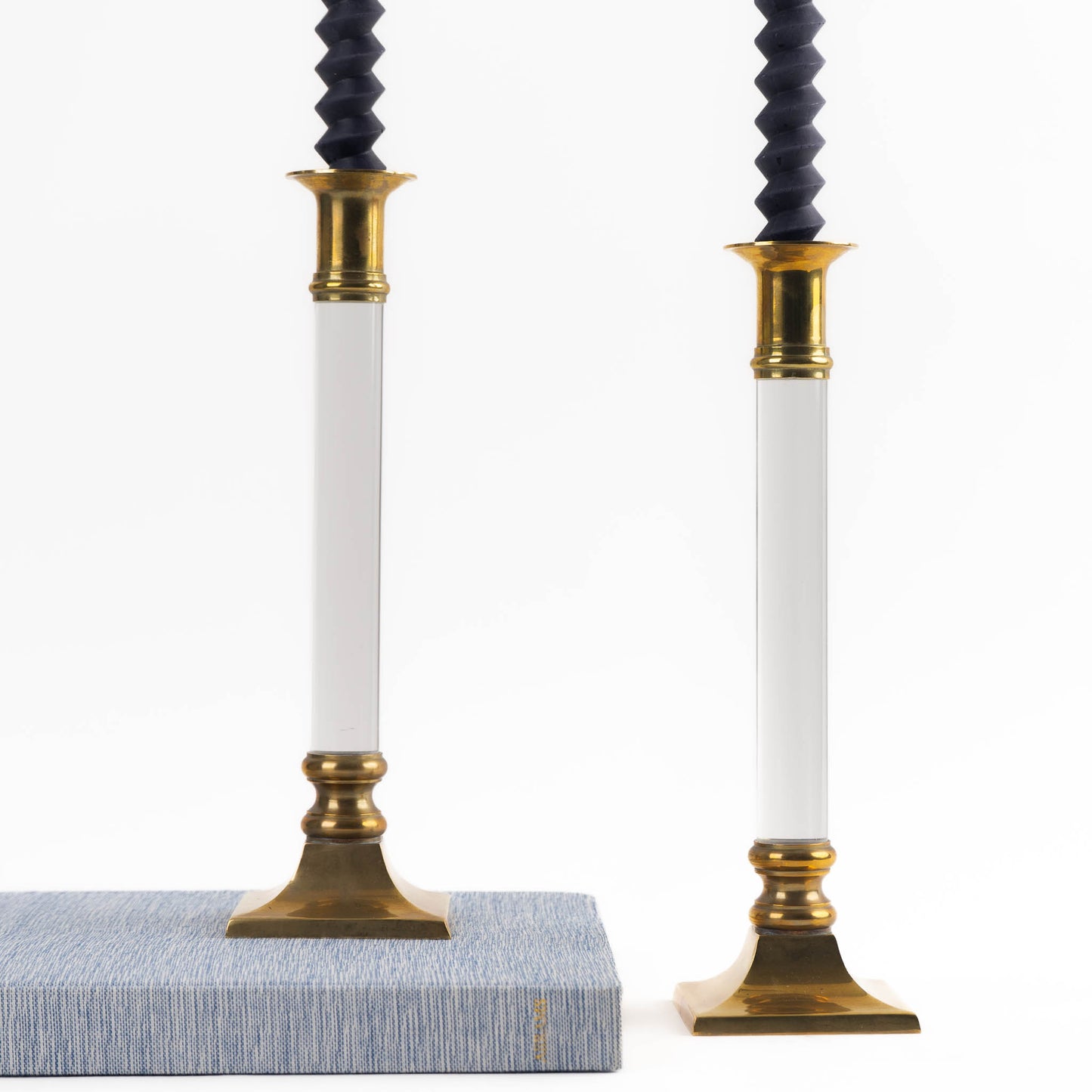 Vintage pair of transparent Lucite candleholders with brass accents for taper candles, styled in Hollywood Regency interior