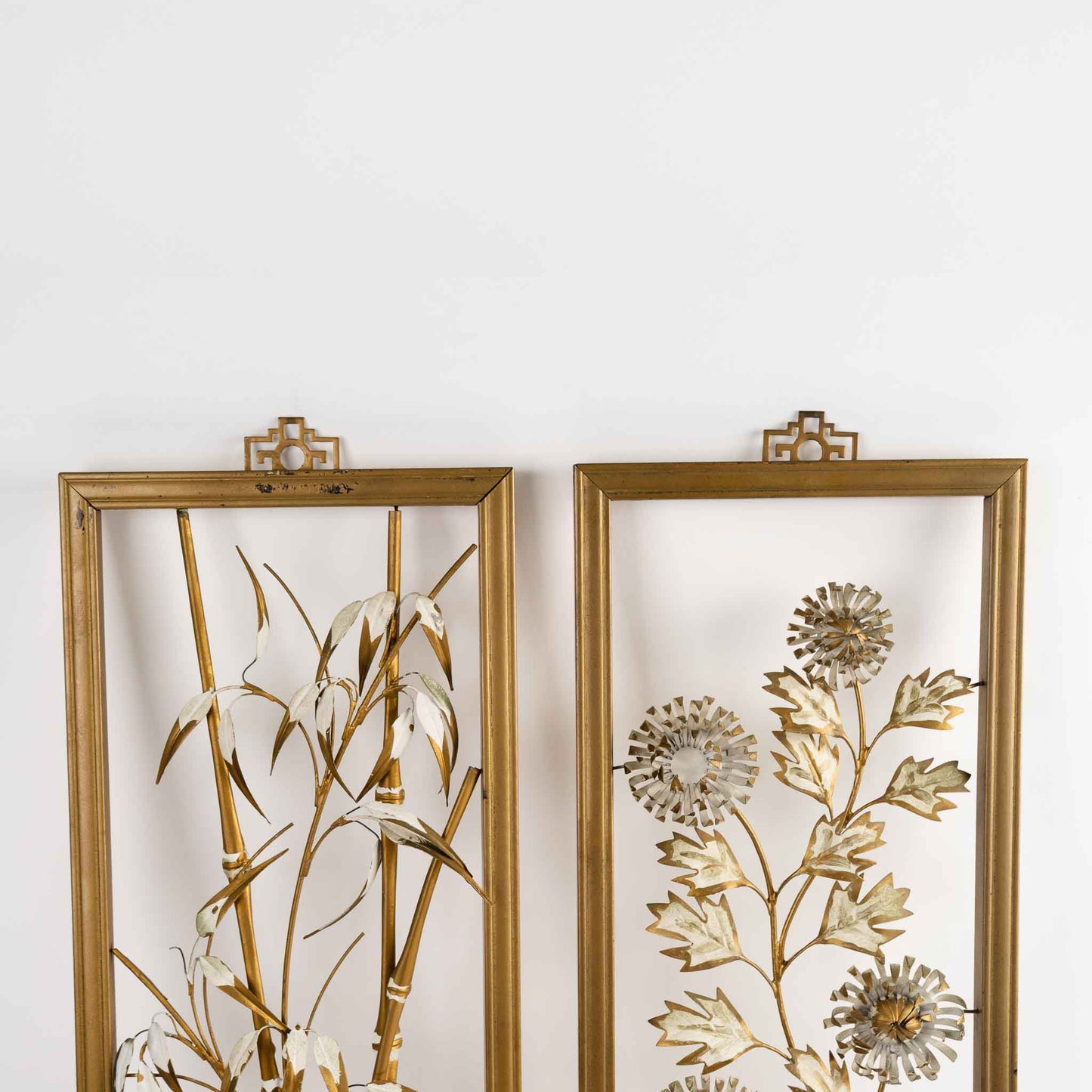 Vintage mid-century dimensional metal flower wall art in gold-tone wooden frames, featuring sculpted gold and cream botanical elements, circa 1950s-1960s
