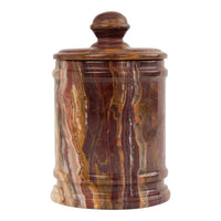Vintage red onyx stone jar with lid showing rich oxblood and brown natural veining