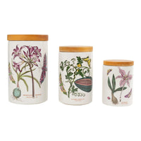 Set of three vintage Portmeirion ceramic storage canisters in graduating sizes with botanical illustrations and wooden lids