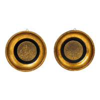Pair of vintage round gold-toned frames containing large decorative brass coins with wall hanging hooks, made in Italy circa 1970s-1980s