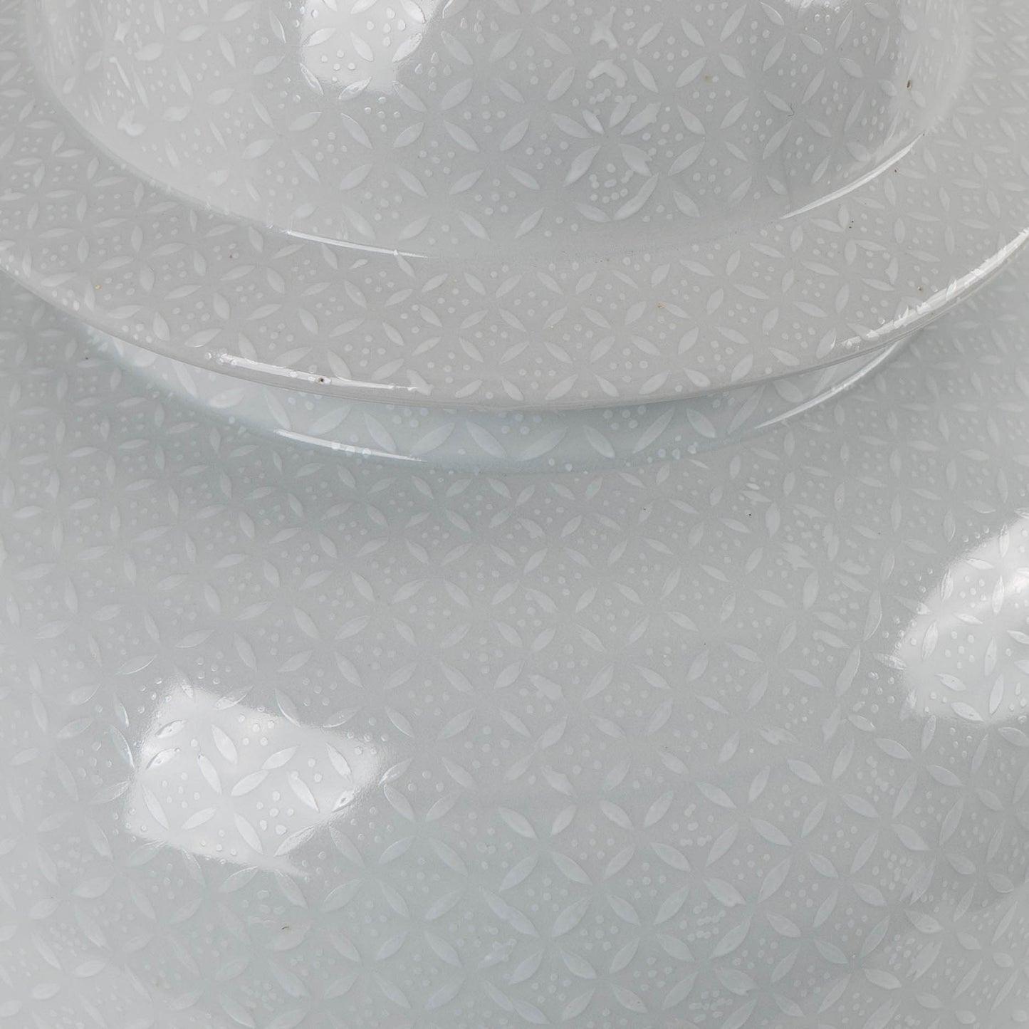 Close-up of white Chinoiserie pattern detail on grey porcelain ginger jar lamp showing delicate Asian-inspired motifs