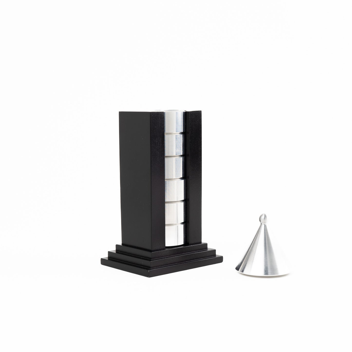 Vintage black building-shaped napkin ring holder displaying six silver metal napkin rings for elegant table setting storage