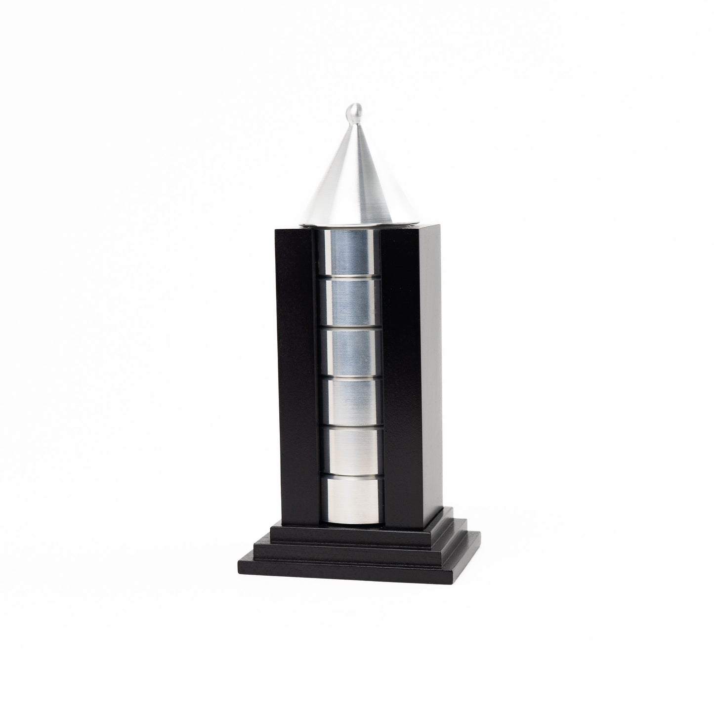 Vintage black building-shaped napkin ring holder displaying six silver metal napkin rings for elegant table setting storage