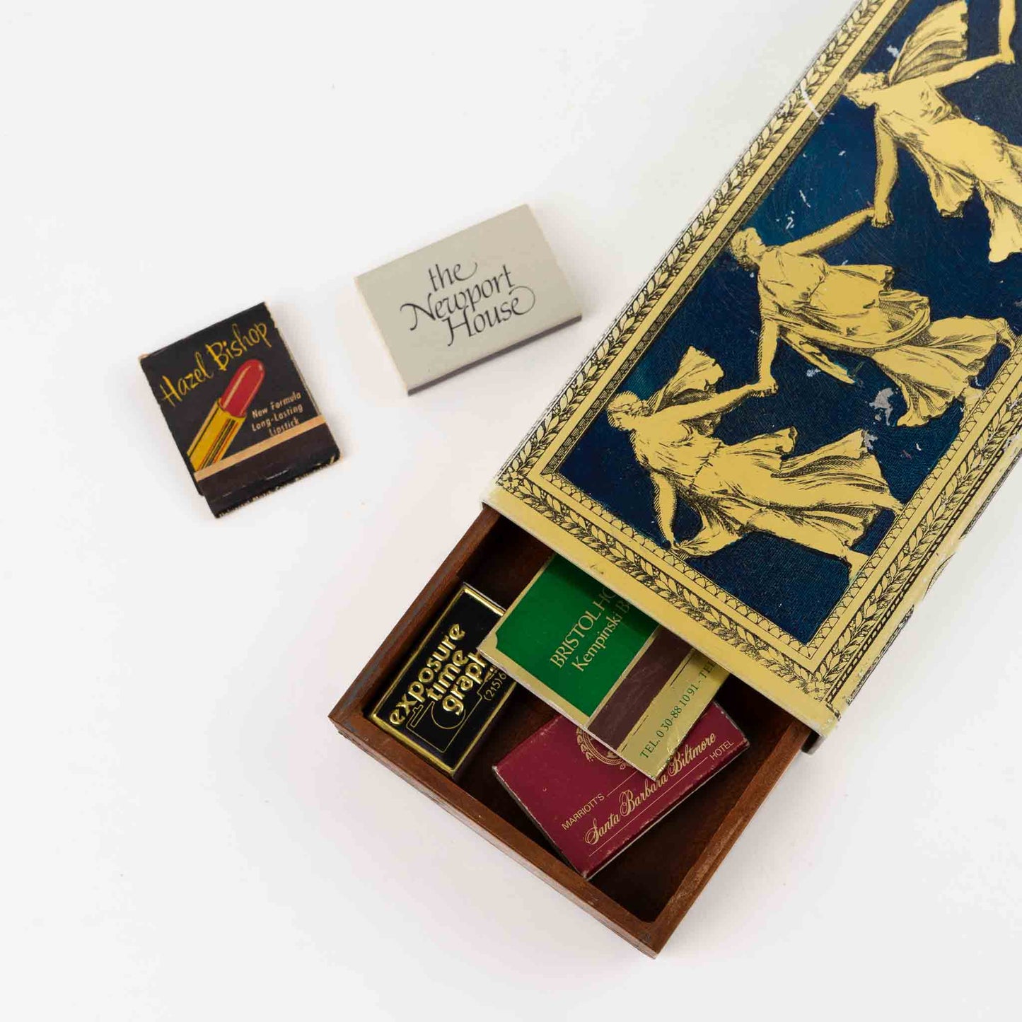 Vintage metal decorative box with Greek dancing muses design and sliding wooden interior compartment for matchbook storage